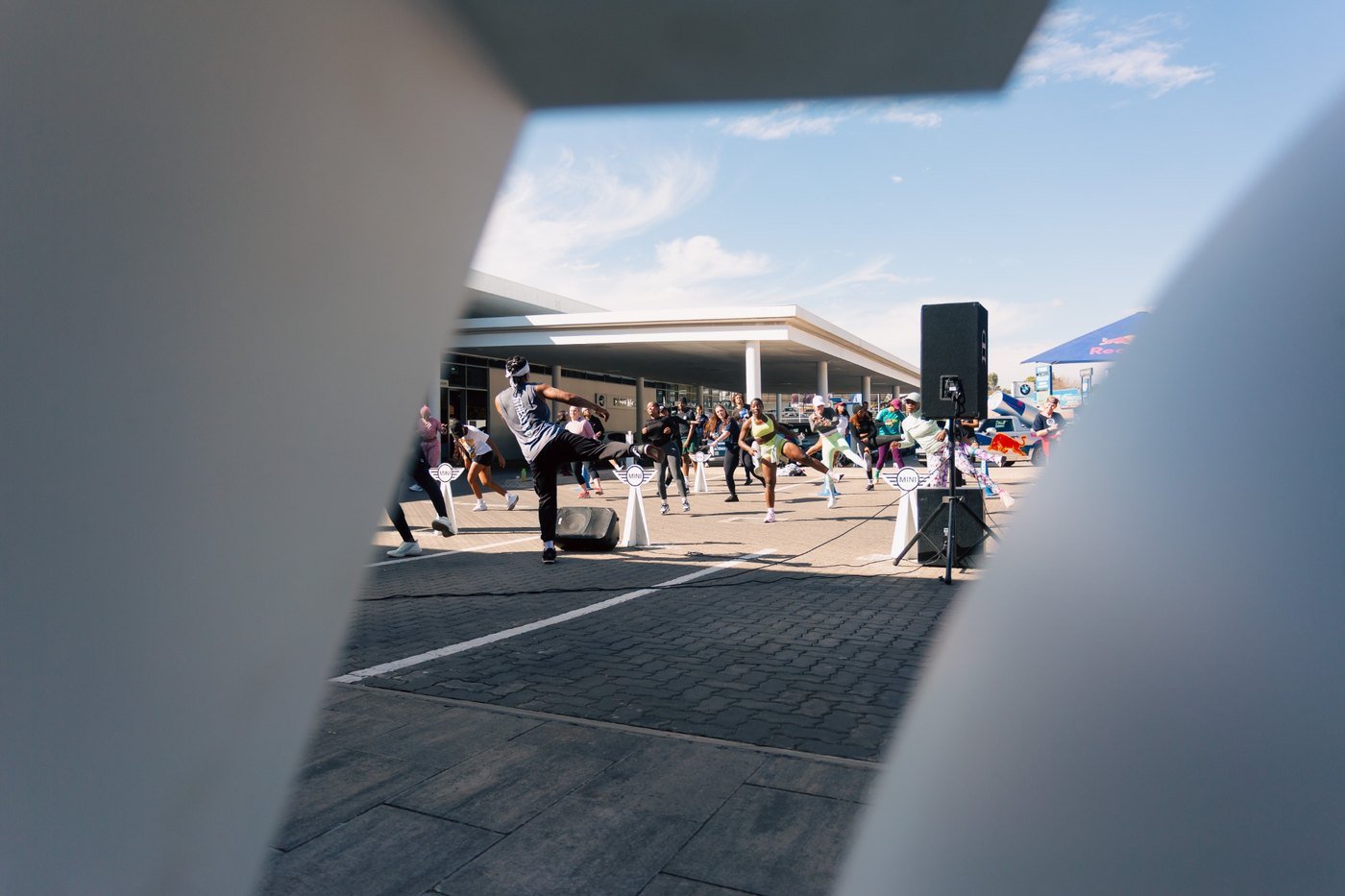 A live fitness activation viewed through a MINI architectural feature