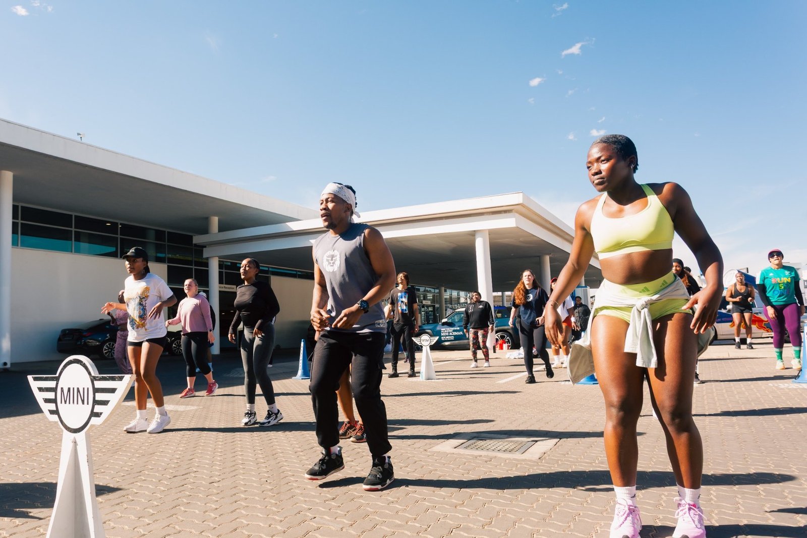 Participants taking part in a live movement activation outside a MINI dealership